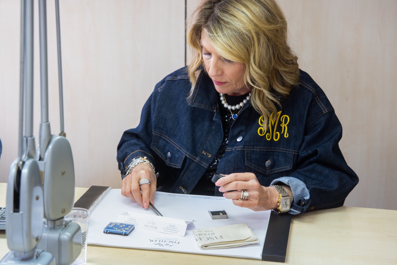 Gina Mitchell reviewing diamonds in Antwerp
